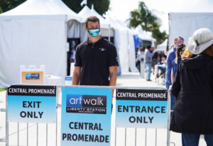 signs for social distancing at an art event outside