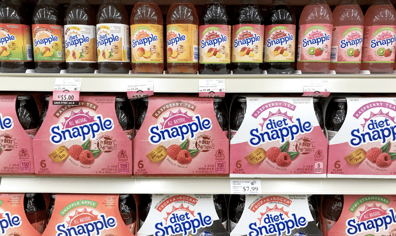 snapple cases on grocery shelf